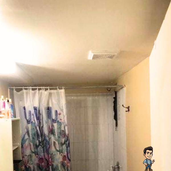 Same basement bathroom with a smooth painted drywall ceiling after the drop ceiling was replaced